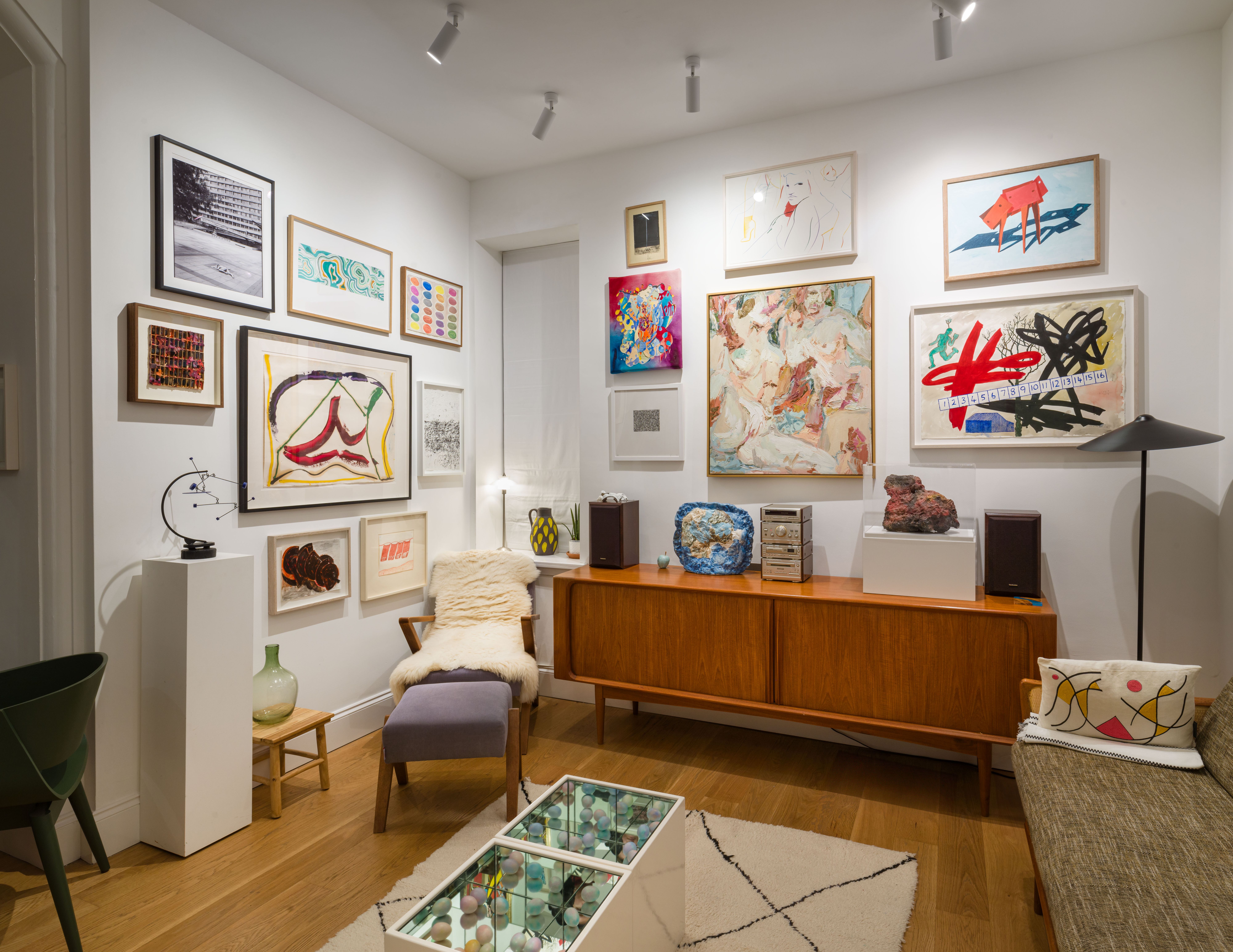 Gallery wall with colorful contemporary artworks