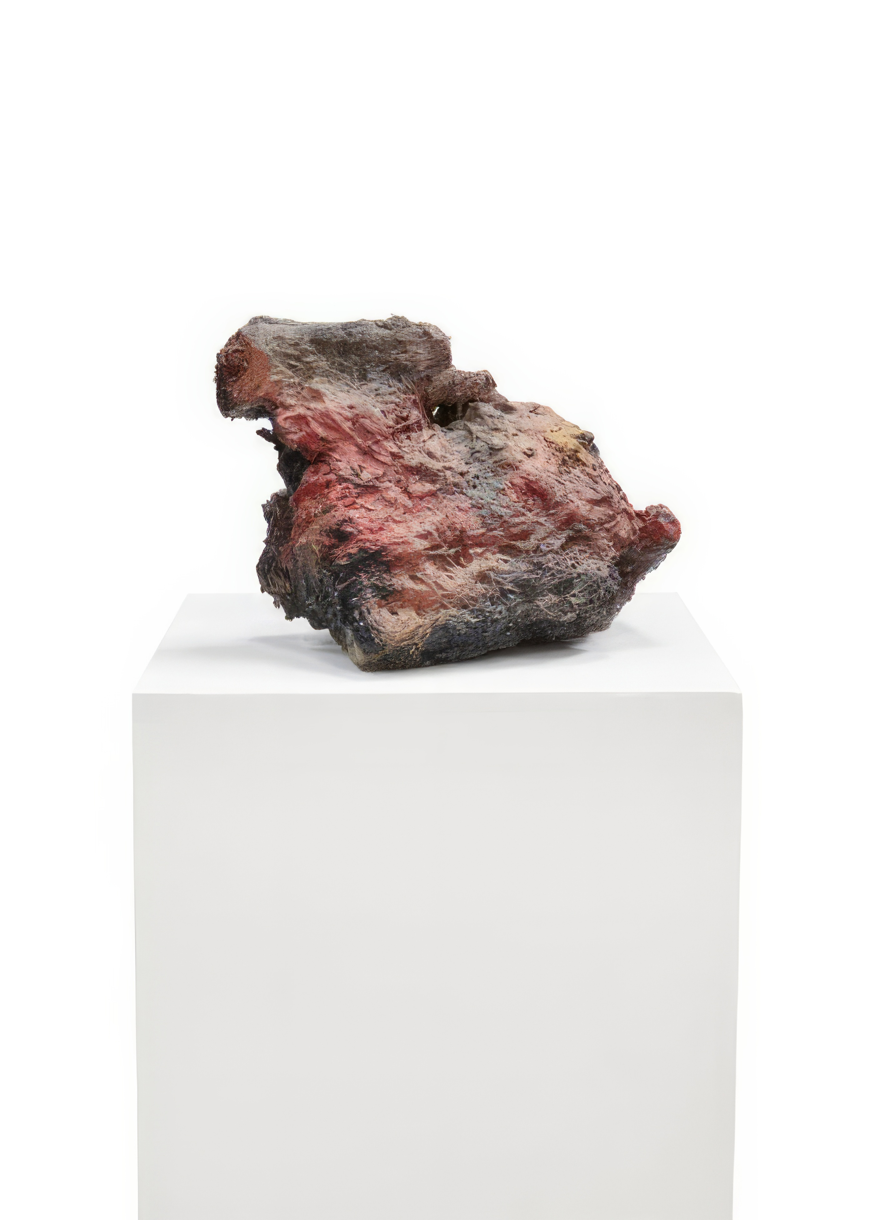 Sculptural form on white pedestal